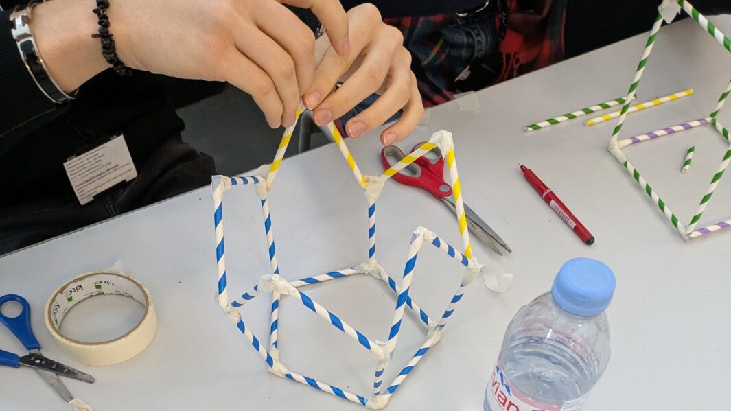 student working on a design project using a wool model