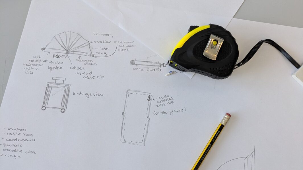 design plans artwork with a tape measure