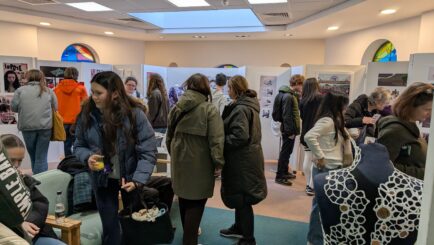 Parents and visitors at Artefact Exhibition Private View in Carmel's Chaplaincy