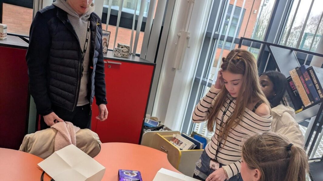 a group of students working together in an art workshop