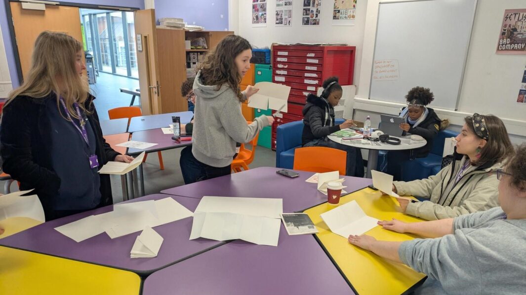 a group of students working together in an art workshop