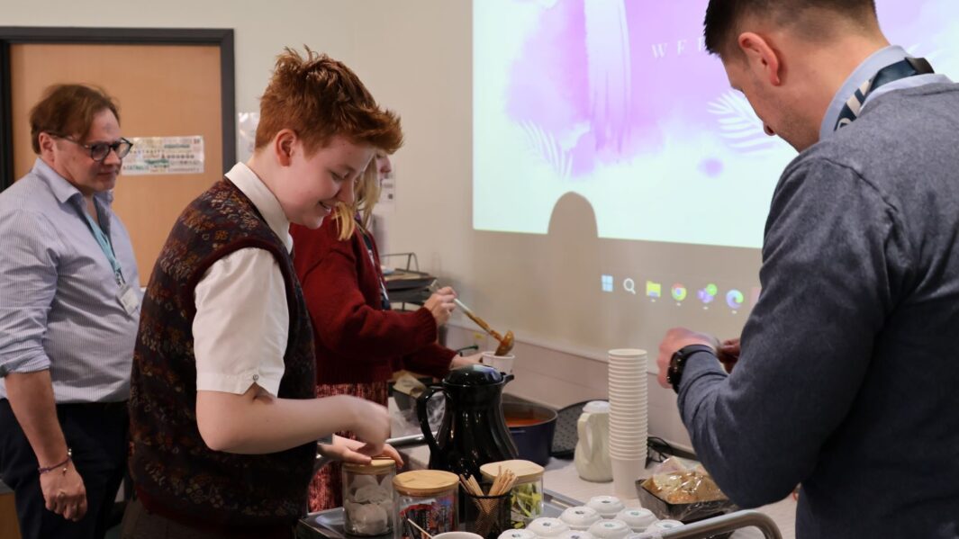 students and staff getting refreshments in the chaplaincy