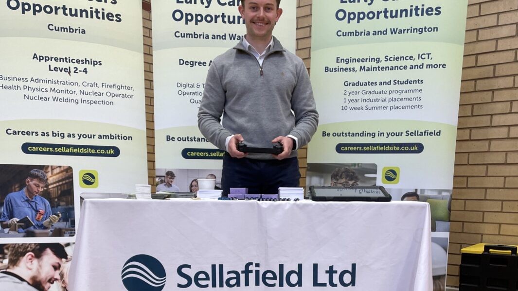 Representative from Sellafield at a desk in the careers fair