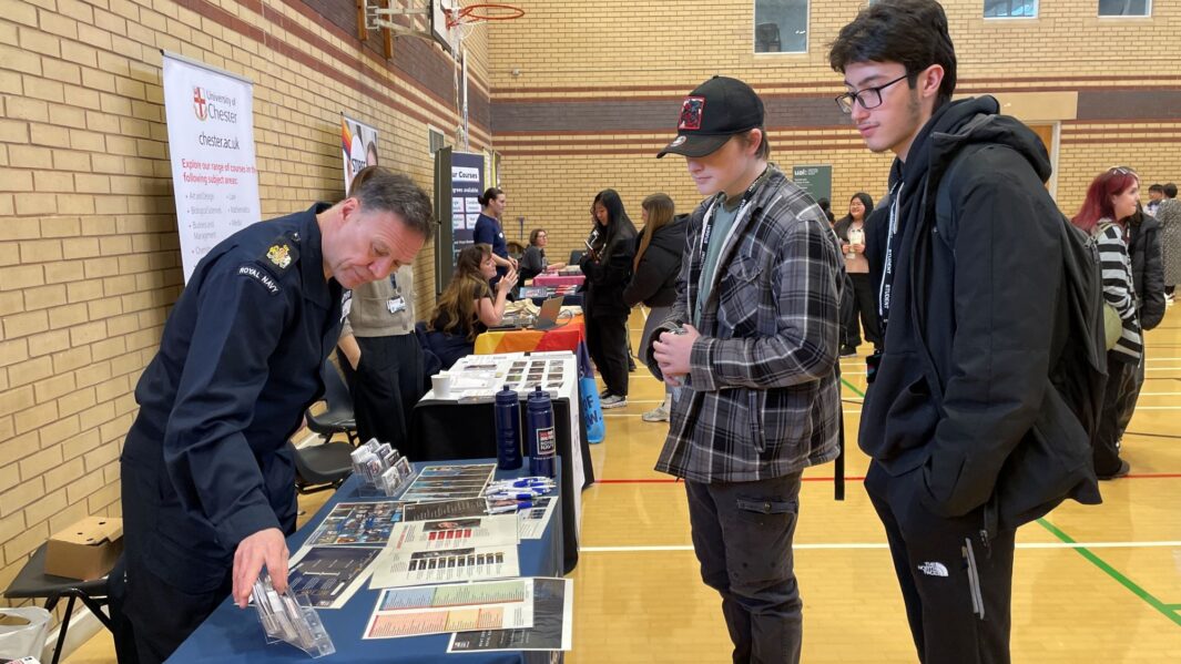 students talking to employers and universities at the careers fair