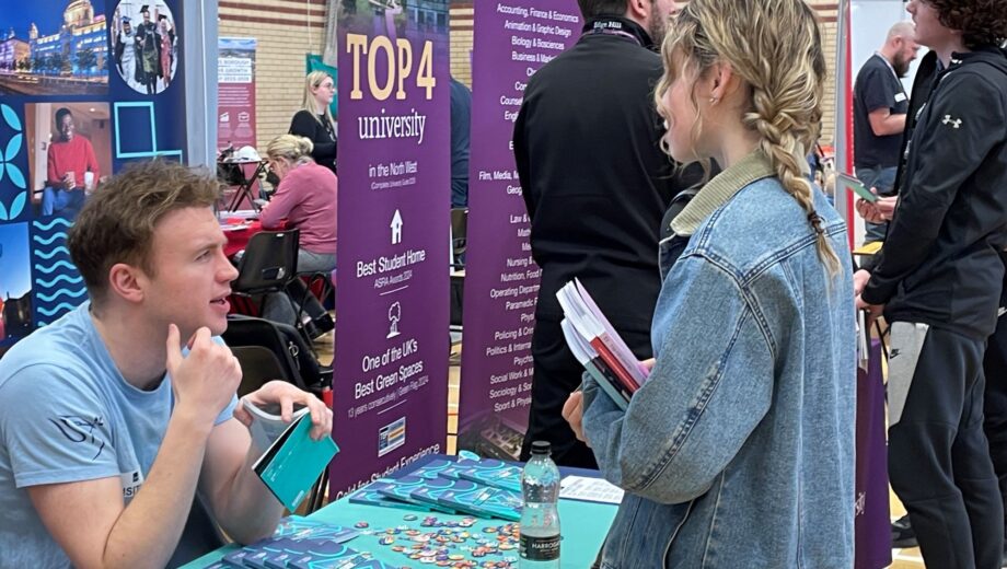 students talking to employers and universities at the careers fair