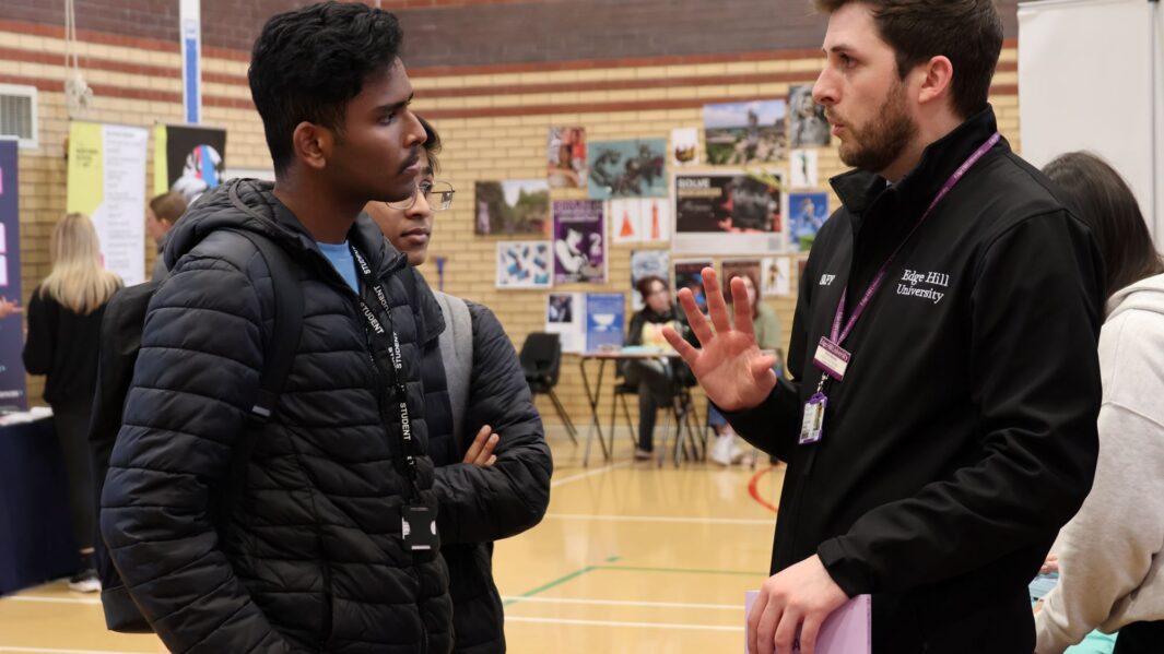students talking to employers and universities at the careers fair