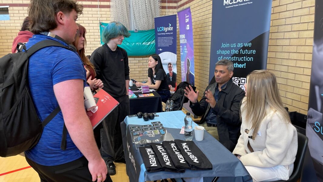 students talking to employers and universities at the careers fair