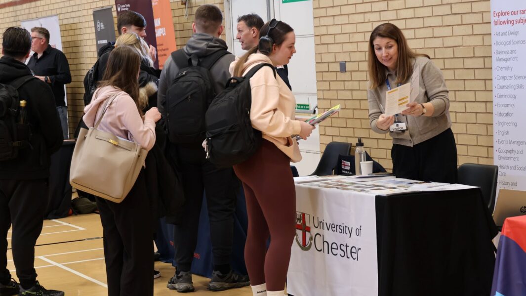 students talking to employers and universities at the careers fair