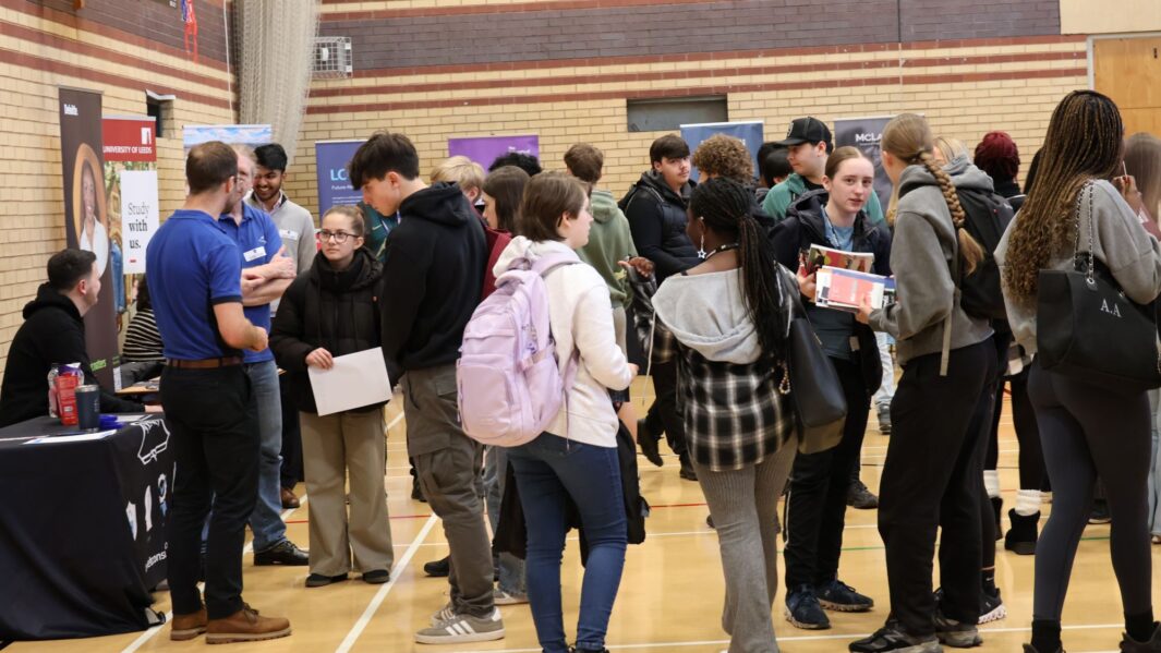 students talking to employers and universities at the careers fair