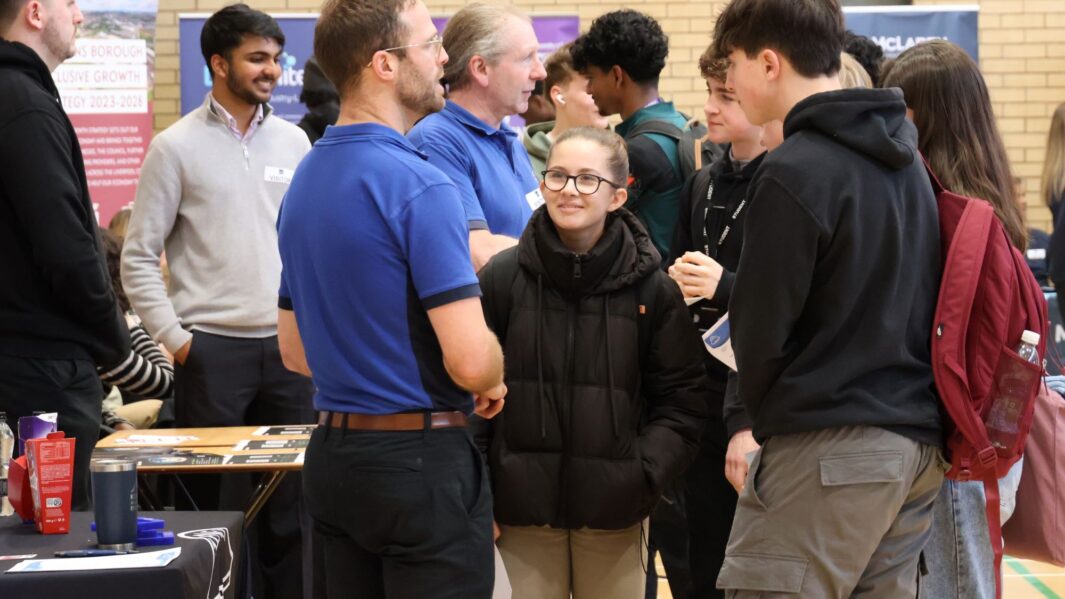 students talking to employers and universities at the careers fair