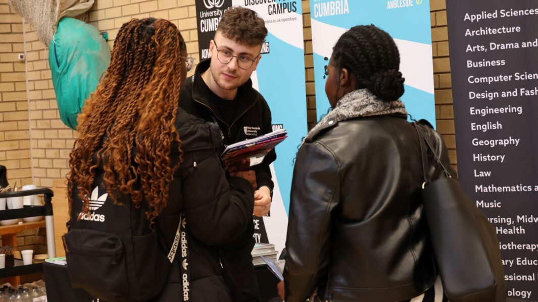 students talking to employers and universities at the careers fair