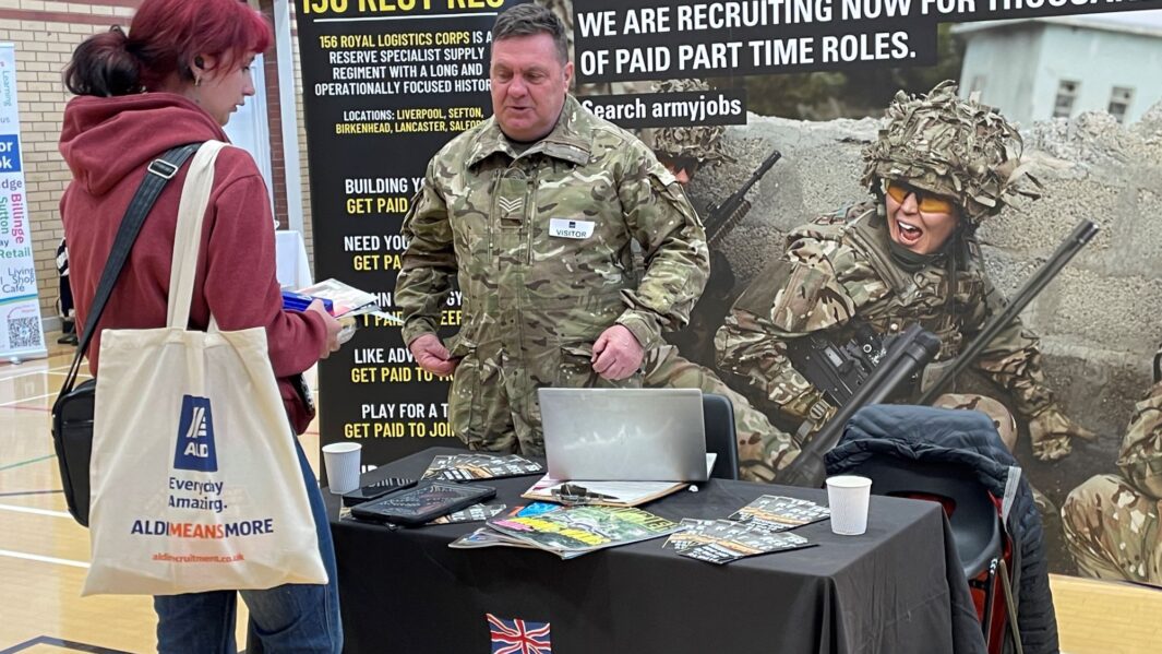 students talking to the army reps at the careers fair