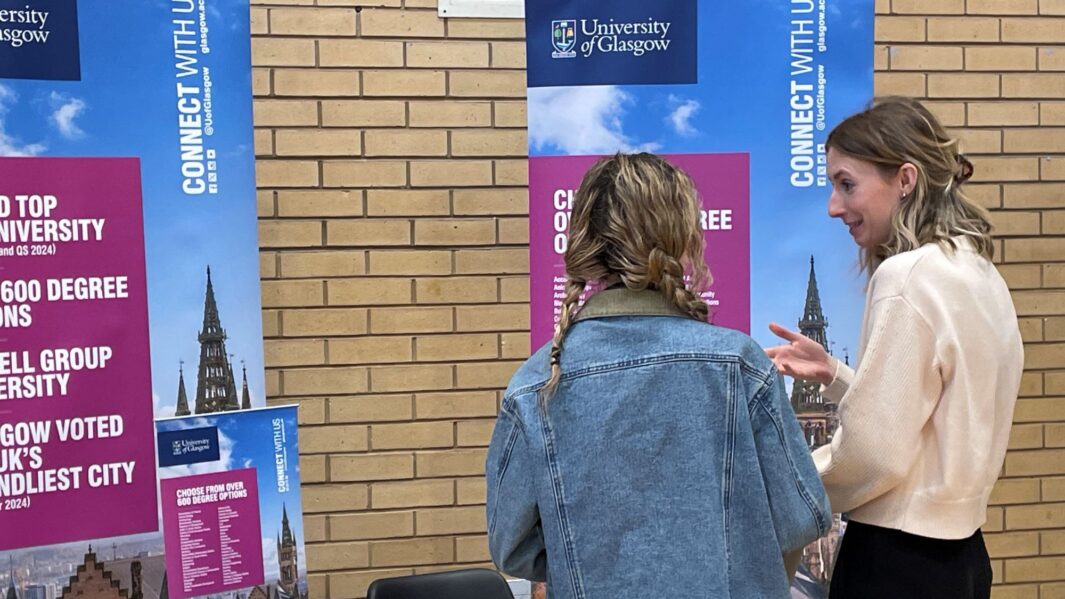 students talking to employers and universities at the careers fair