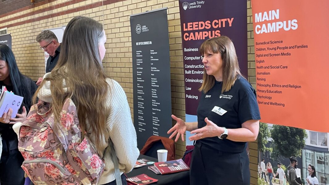 students talking to employers and universities at the careers fair