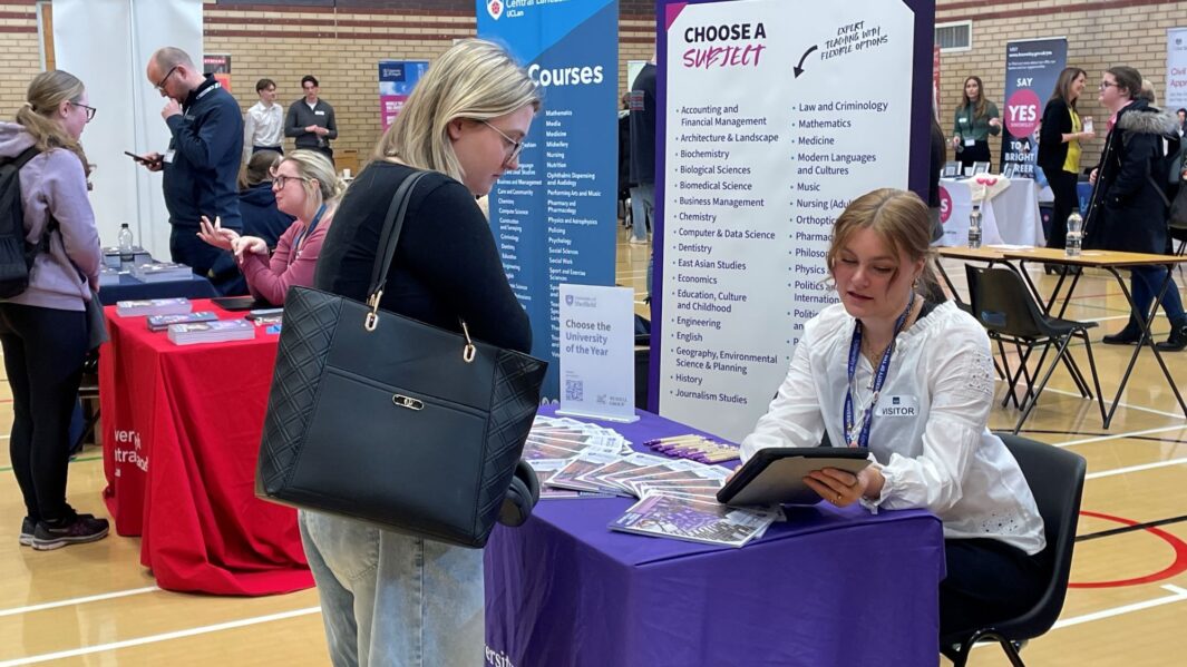 students talking to employers and universities at the careers fair