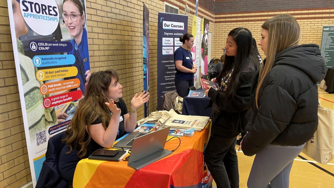 students talking to employers and universities at the careers fair