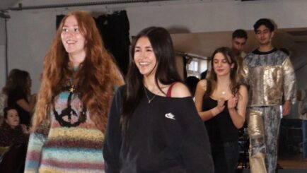 Students on a catwalk at a fashion show