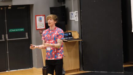 Dr Tom Crawford delivering a talk at Carmel College