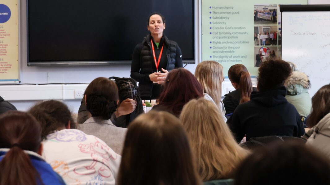 Claire Cockburn talking to to students in class
