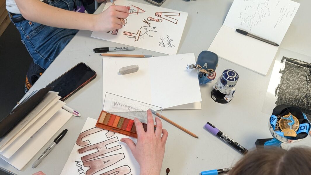 Students in class at an art workshop with James Rice