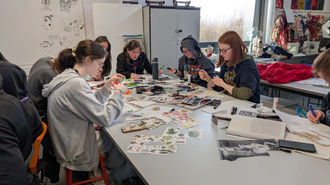 Students in class at an art workshop with James Rice
