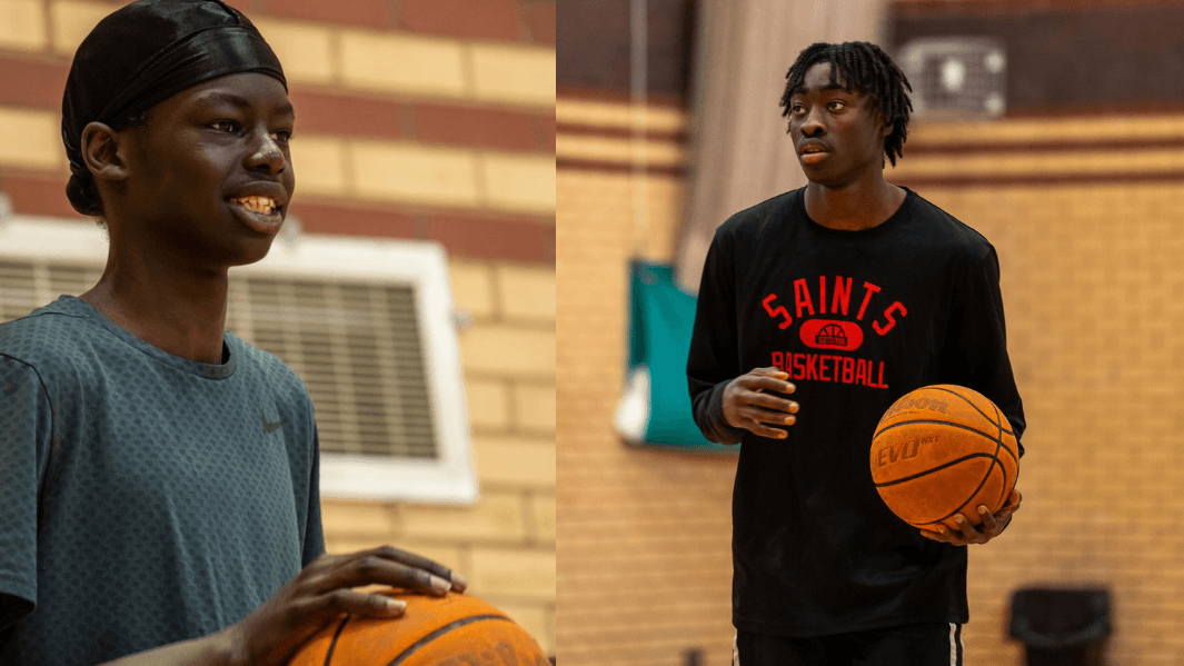 Two Male Students Playing Basketball