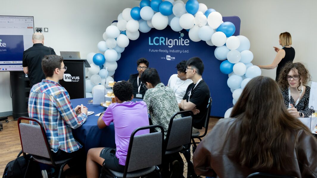 Group of students sat at a table
