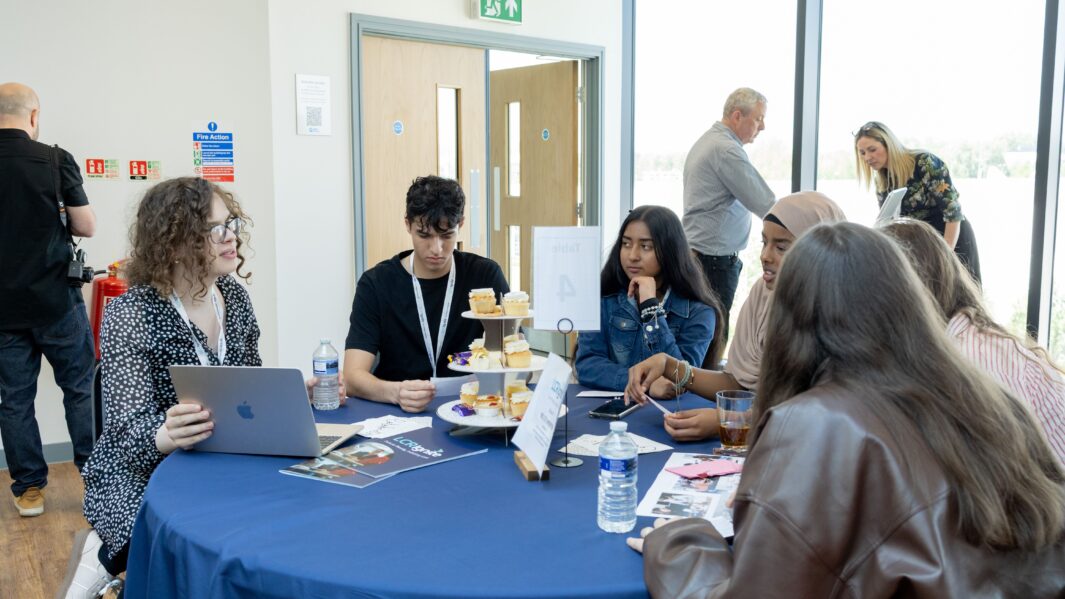 Group of students sat at a table
