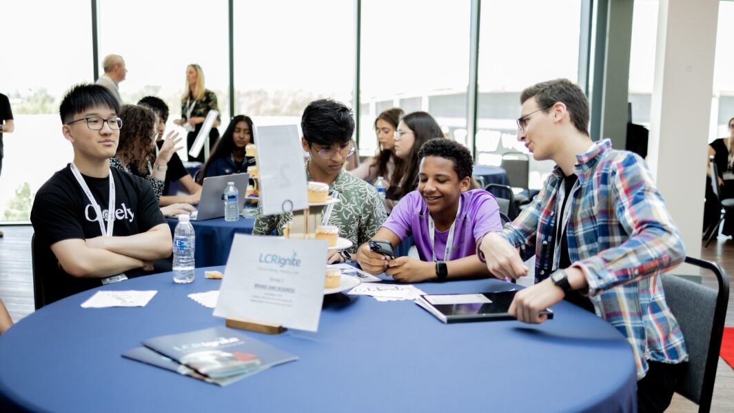 Group of students sat at a table