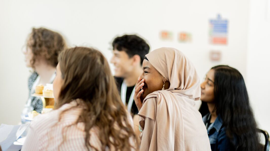 side profile of student laughing