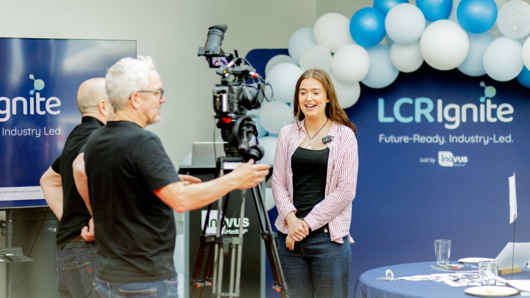 Female student talking to film crew