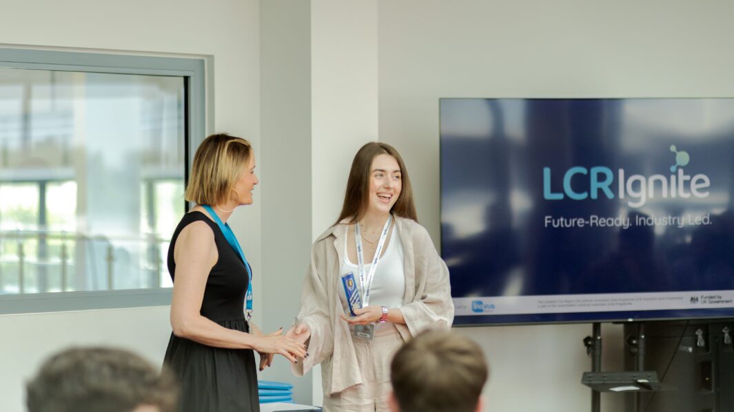 Female student receiving award