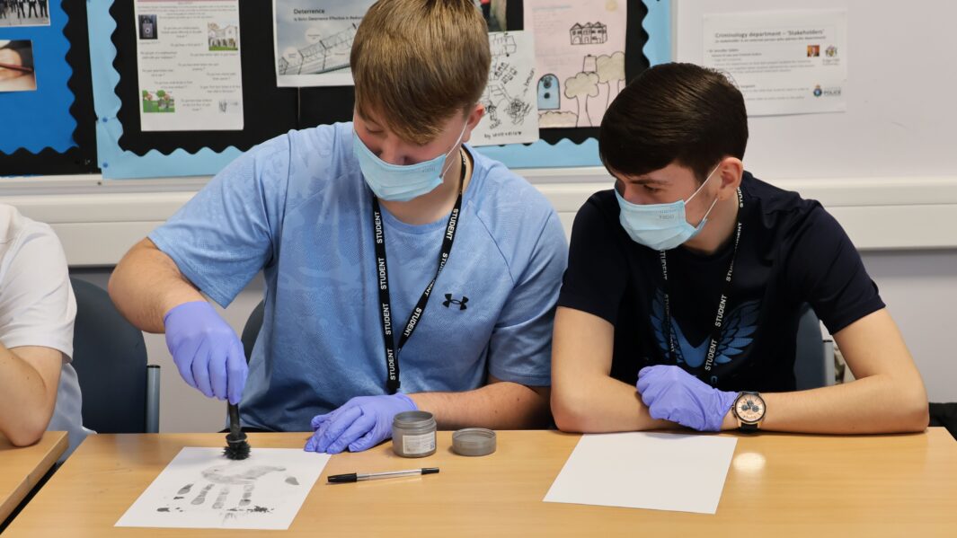 two students looking at crime scene work
