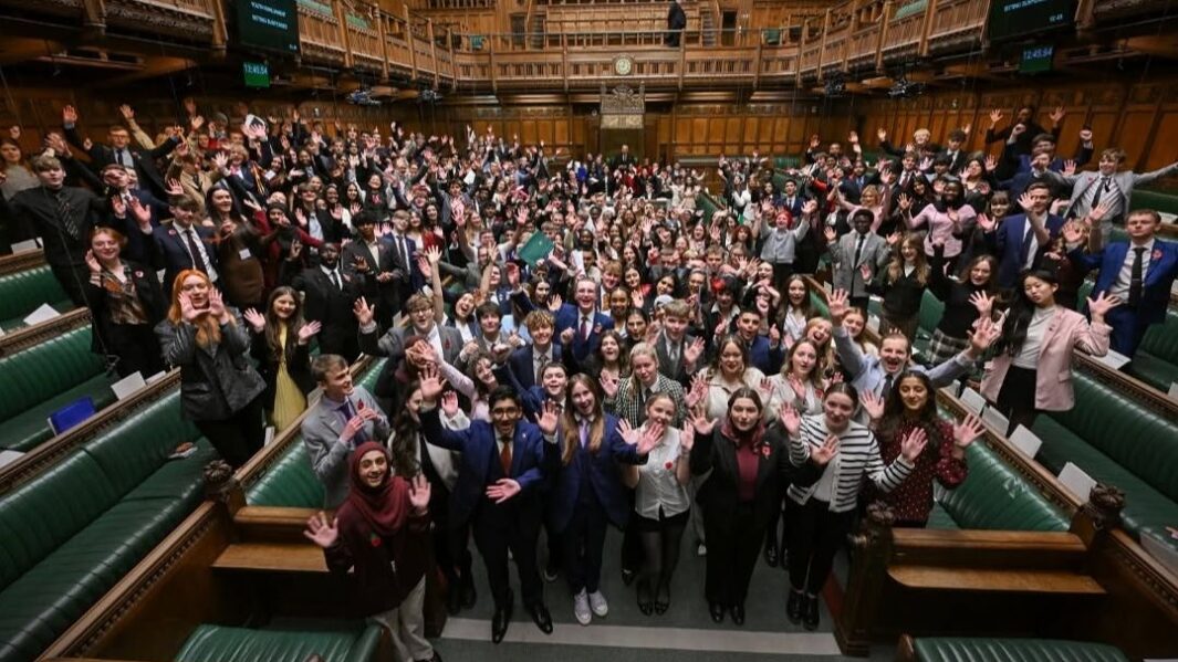 Photo of Carmel student Anja Gocesvska at the House of Commons in a large group pic