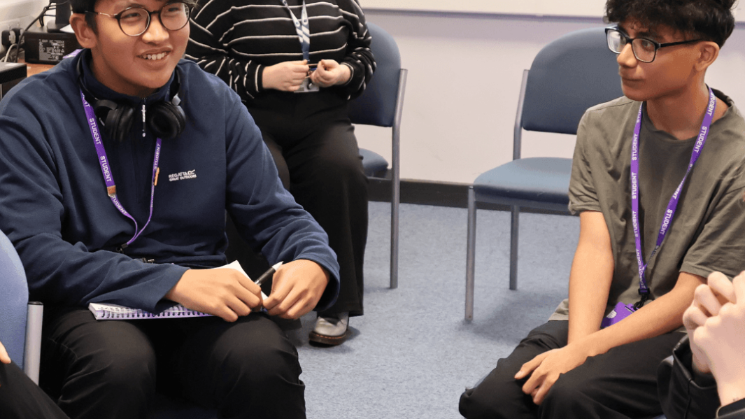 two male students taking part in a mental health training session