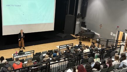 Photo of HMCTS director delivering a talk in the Dalton Theatre