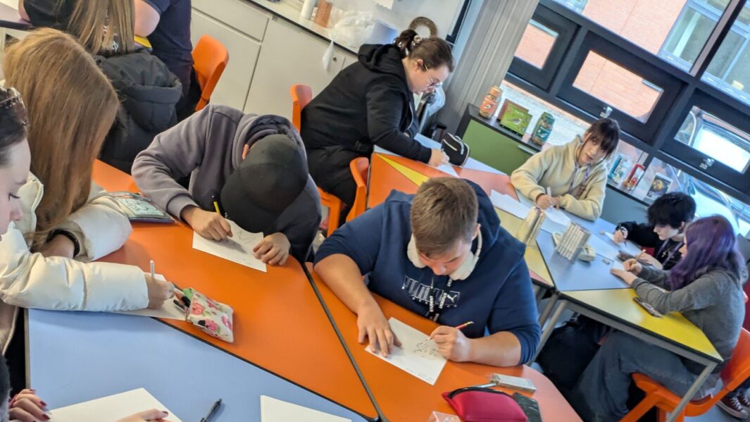 A group of students taking part in a workshop