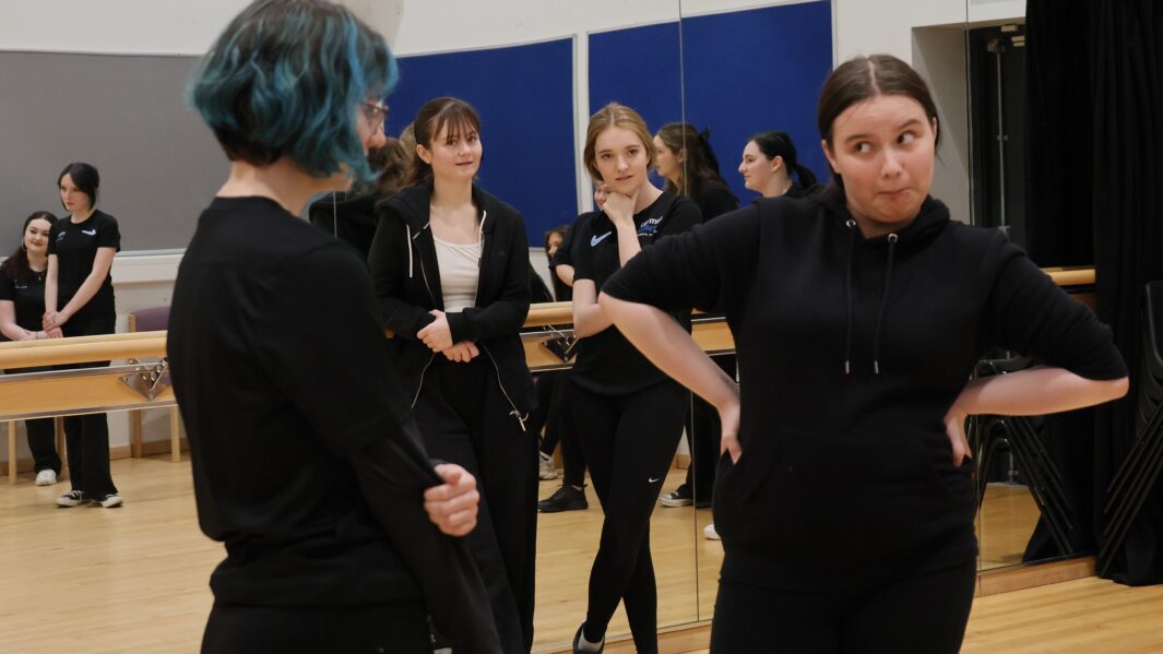 two students acting out a scene from a monologue