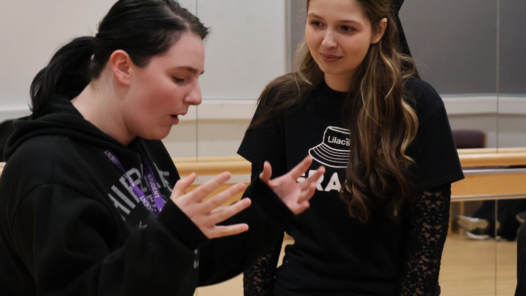 two students acting out a scene from a monologue