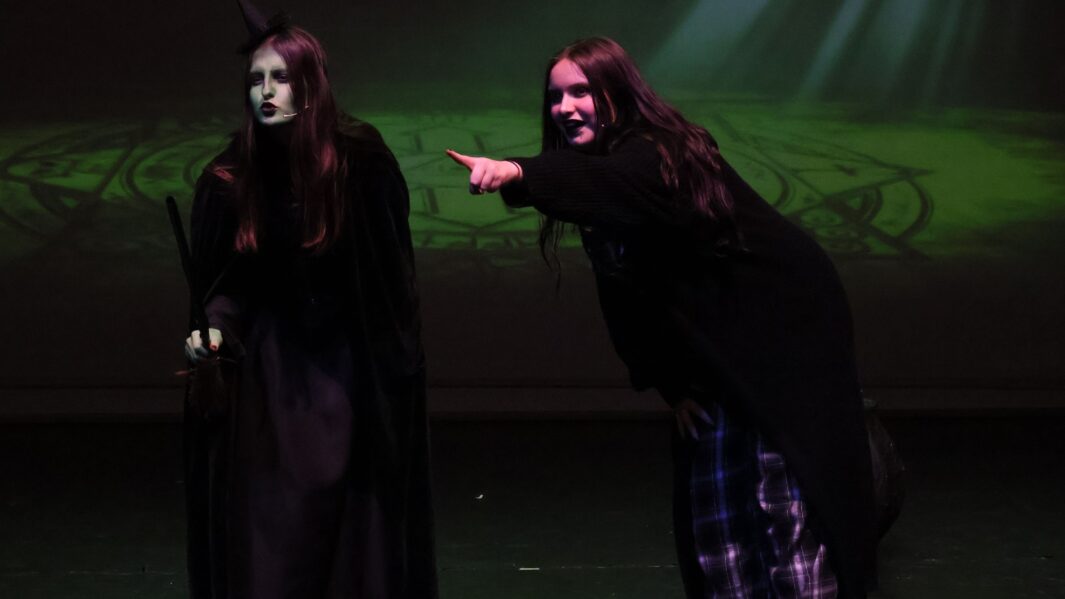 Student dreessed as the wicked witch in the wizard of oz panto