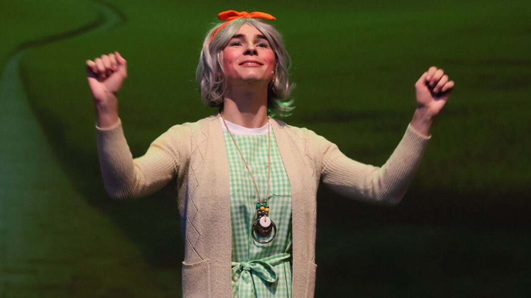 Male student dressed as a woman for wizard of oz panto