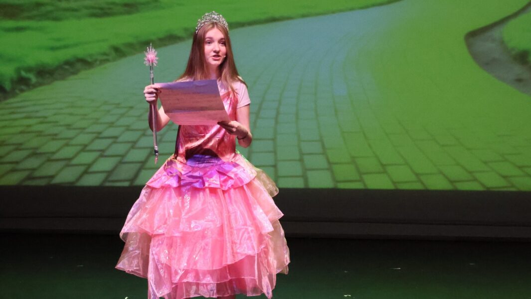 Student dressed as Glenda in the Wizard of Oz panto