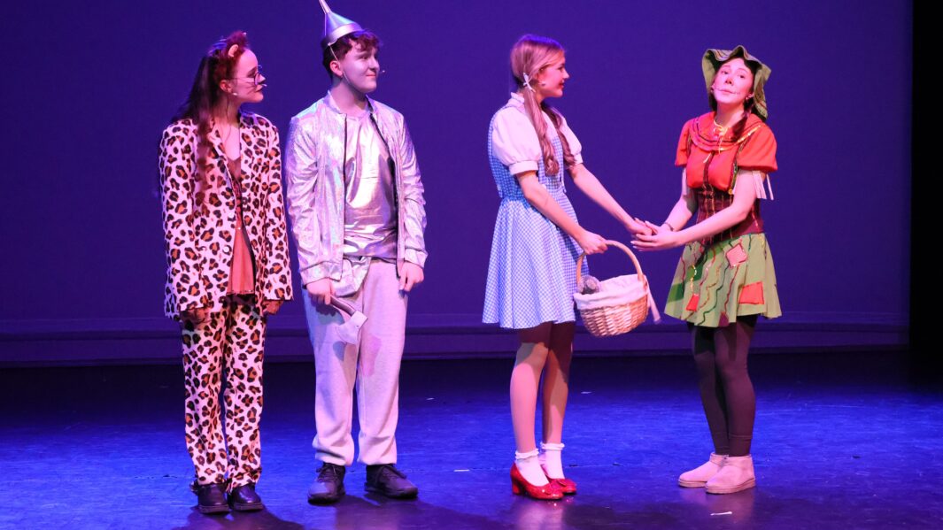 Students dressed as the main characters in the wizard of oz panto