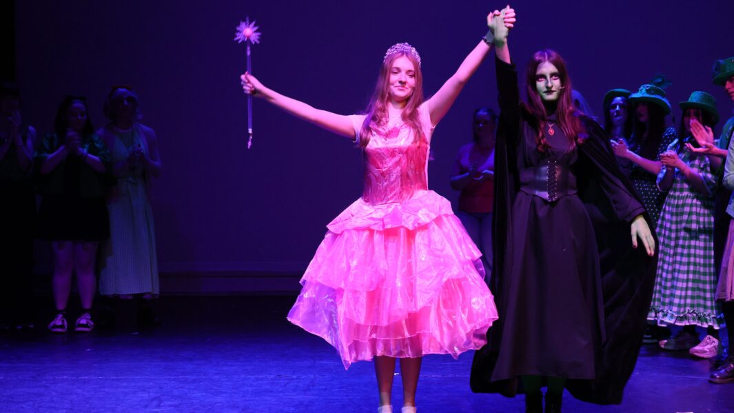 Students dressed as witches in wizard of oz panto