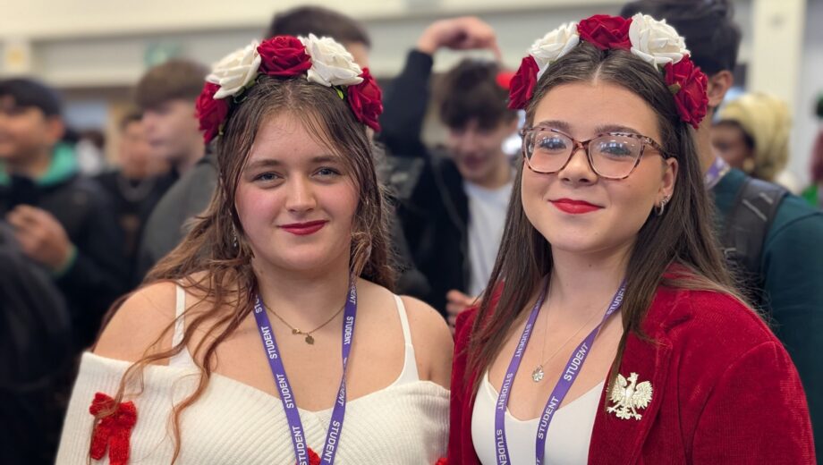 2 female students in traditional dress for culture day