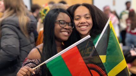 2 female students in traditional dress for Carmel culture day