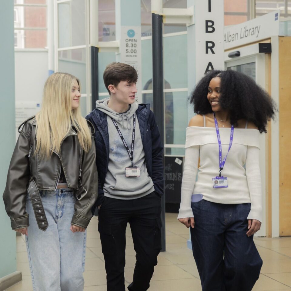 Group of students walking by the library