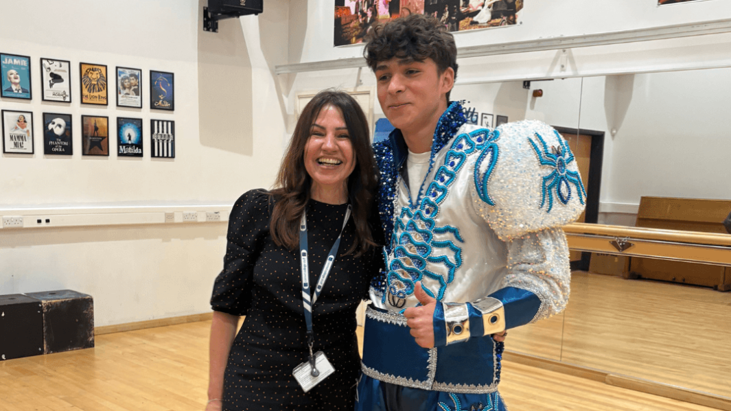 A Spanish students dressed in traditional costume with Spanish teacher Sandra in the dance studio