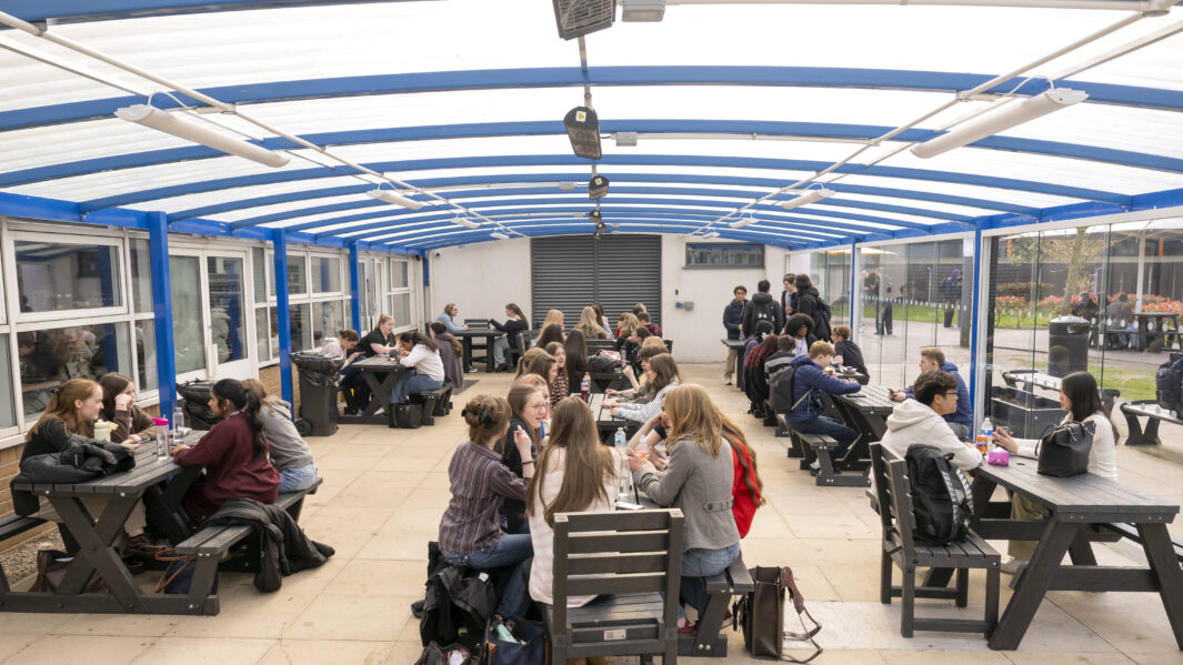 Students in covered area of cafe