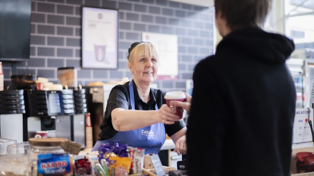 Lady serving coffee in Carmel's Costa cafe